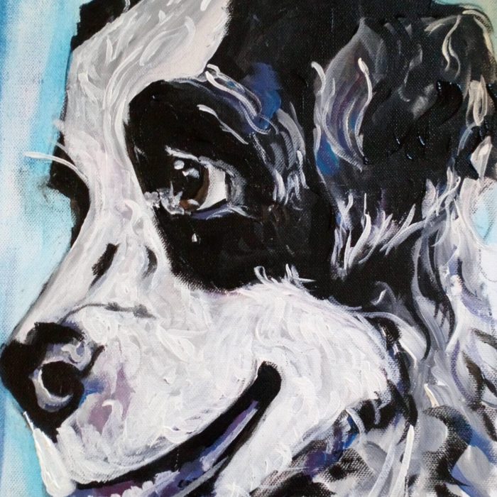 Black and white dog painted on canvas in acrylic